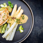 Modern Style German Fried Cod Fish Filet With White Asparagus In