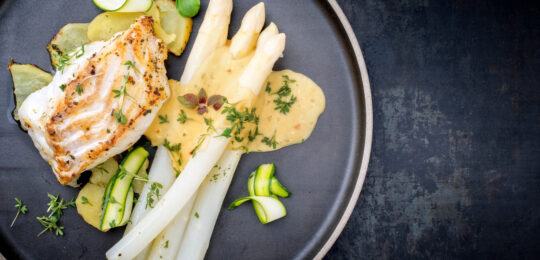Modern Style German Fried Cod Fish Filet With White Asparagus In