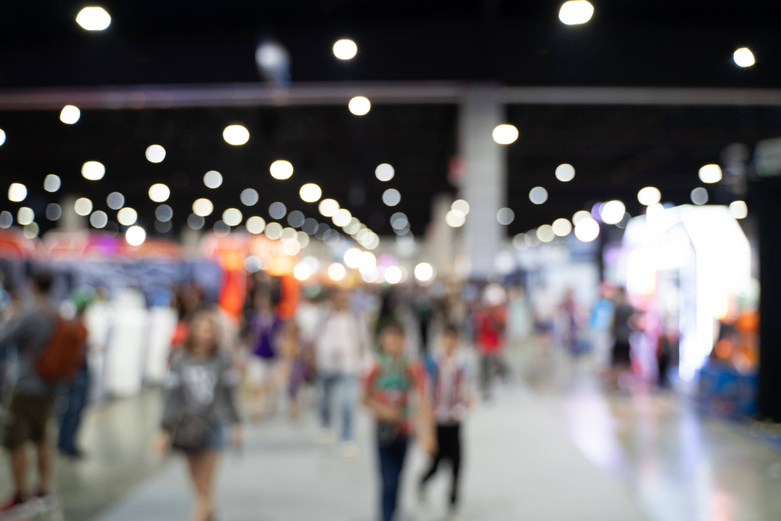 Blurred Images Of Trade Fairs In The Big Hall. Image Of People W