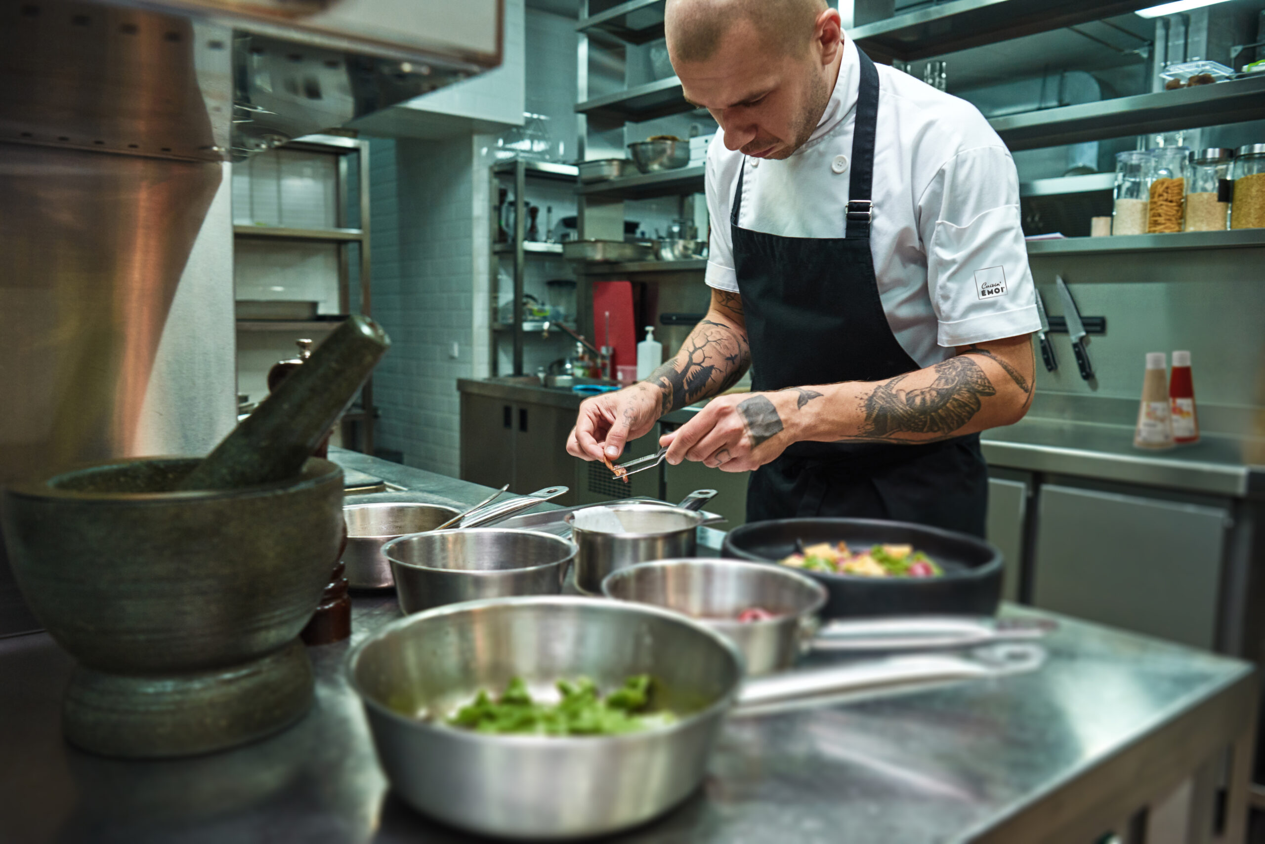 Creative Cooking. Confident Chef With Several Tattoos On His Arm
